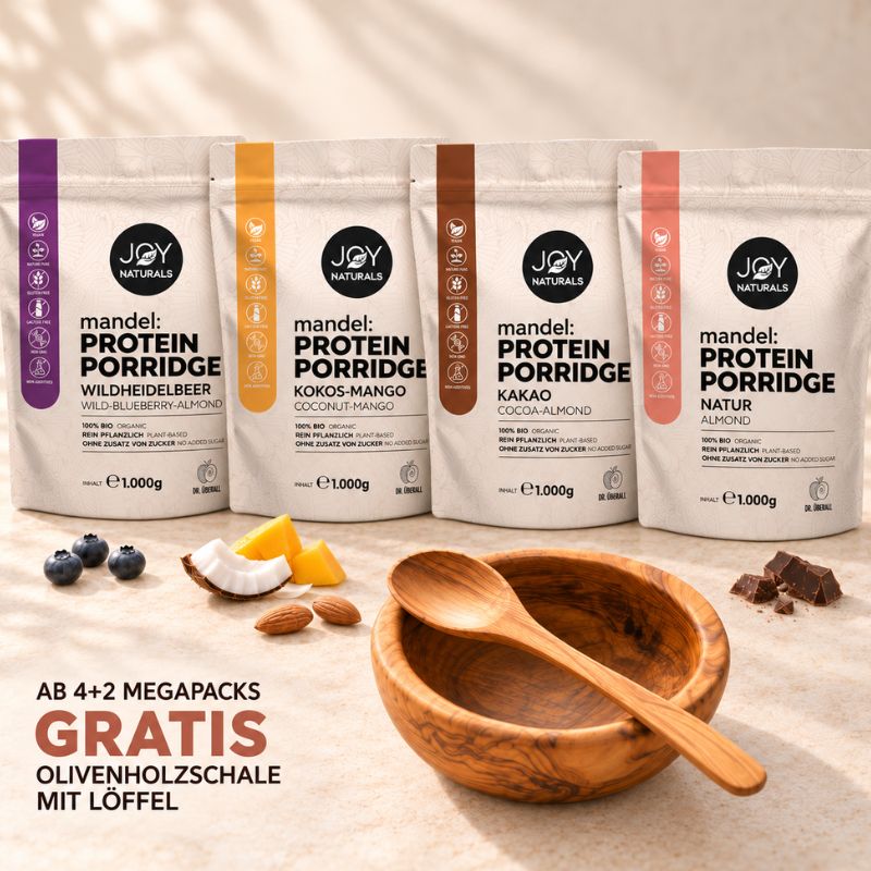 JOY NATURALS Mandel Protein Porridge: vier 1.000-g-Beutel in Wildheidelbeer, Kokos-Mango, Kakao und Natur. Olivenholzschale mit Löffel gratis ab 4+2 Megapacks.
